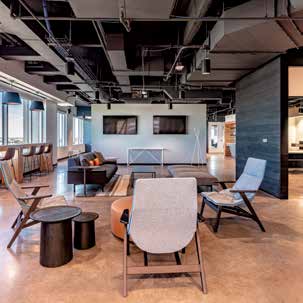 a modern office with chairs and tables